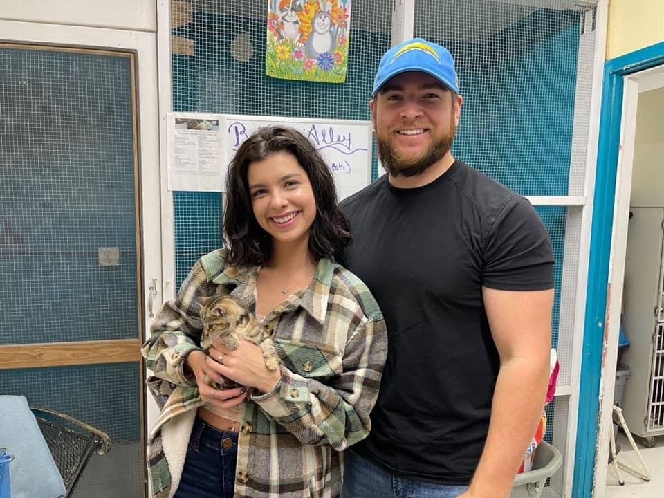 A newly adopted pet with their family