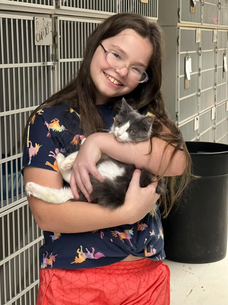 A newly adopted pet with their family