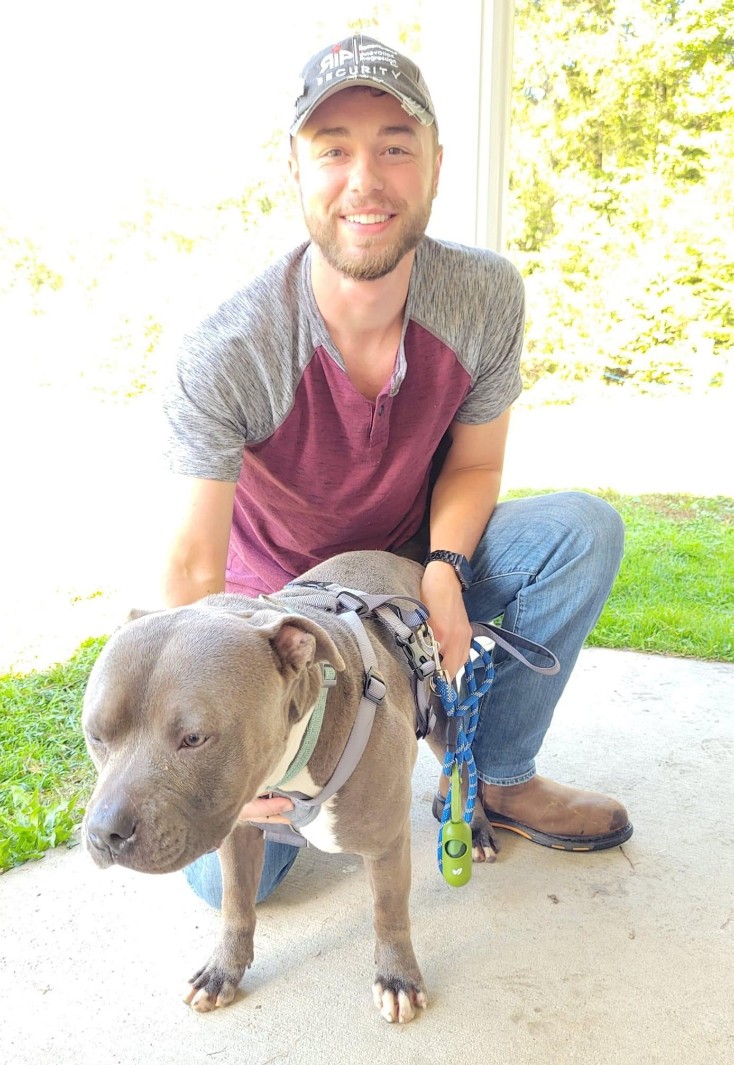 A newly adopted pet with their family