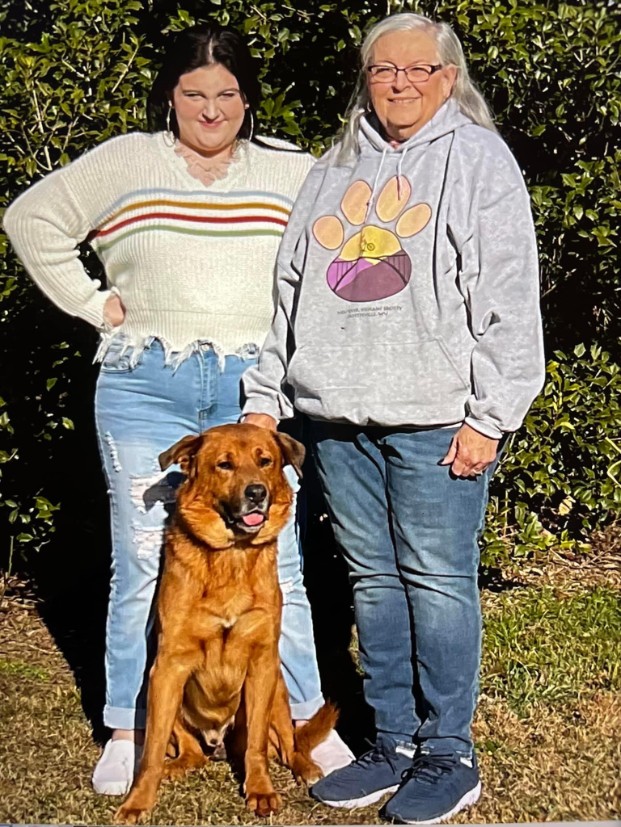 A newly adopted pet with their family