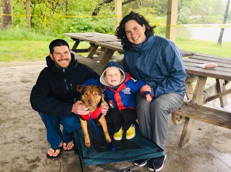 A newly adopted pet with their family