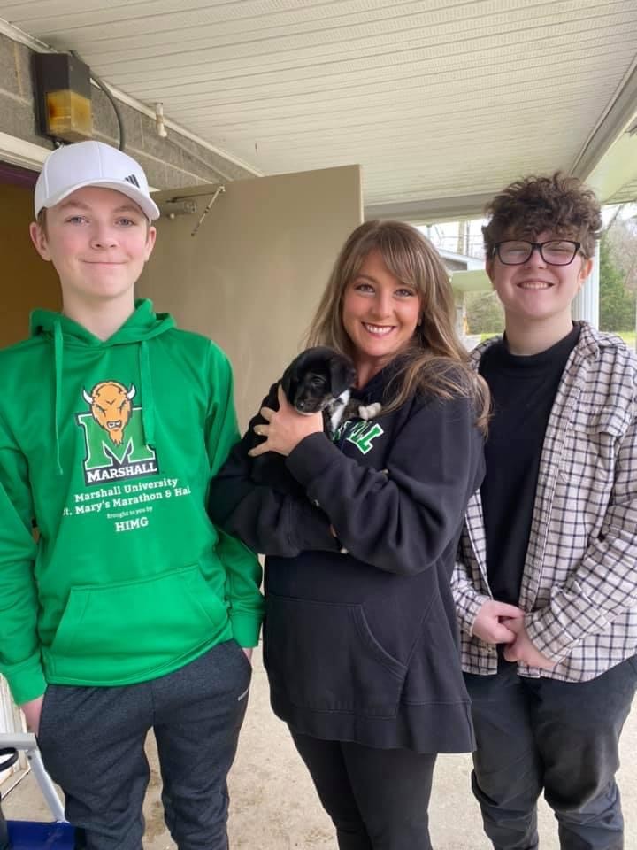A newly adopted pet with their family
