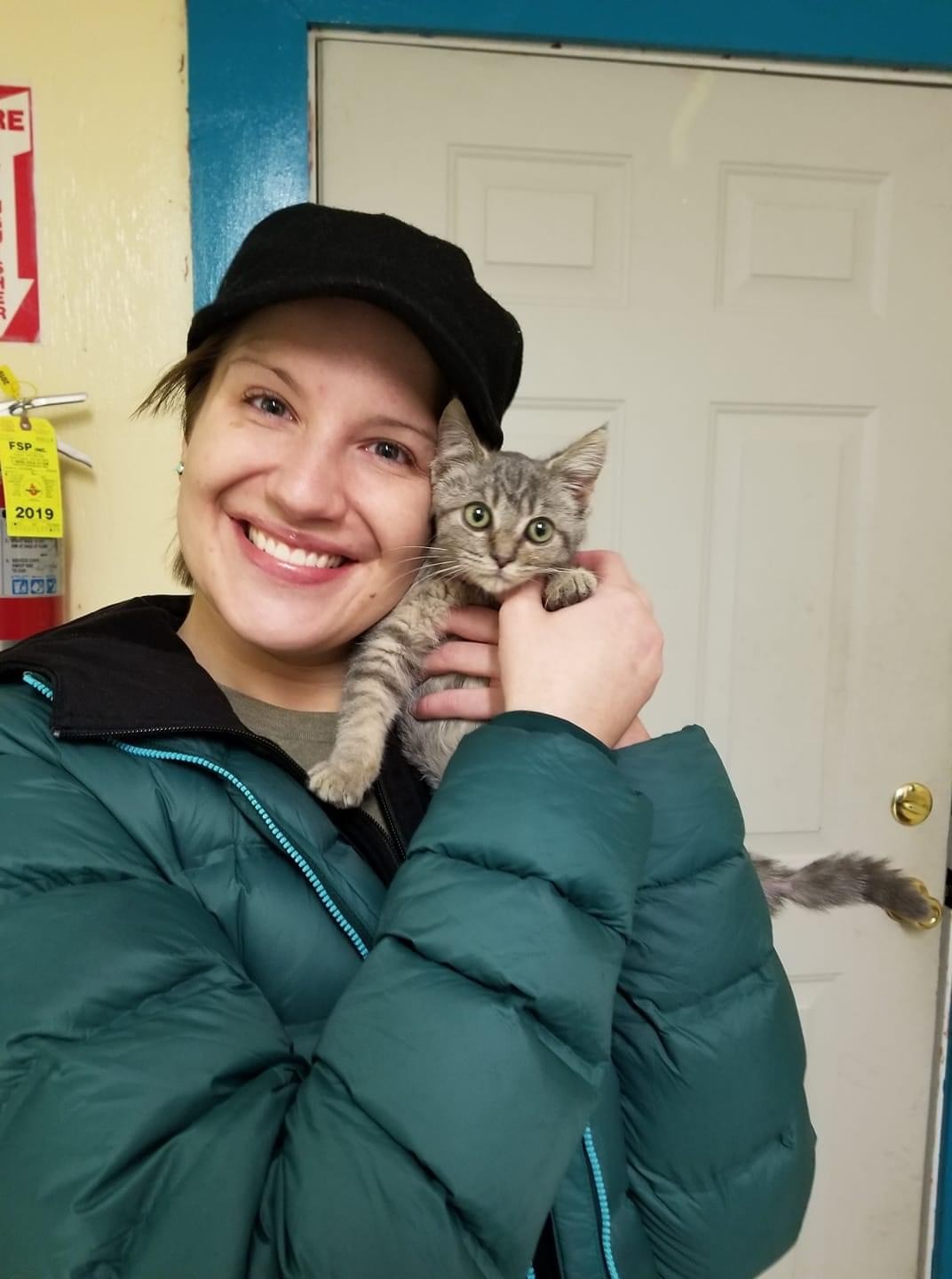 A newly adopted pet with their family
