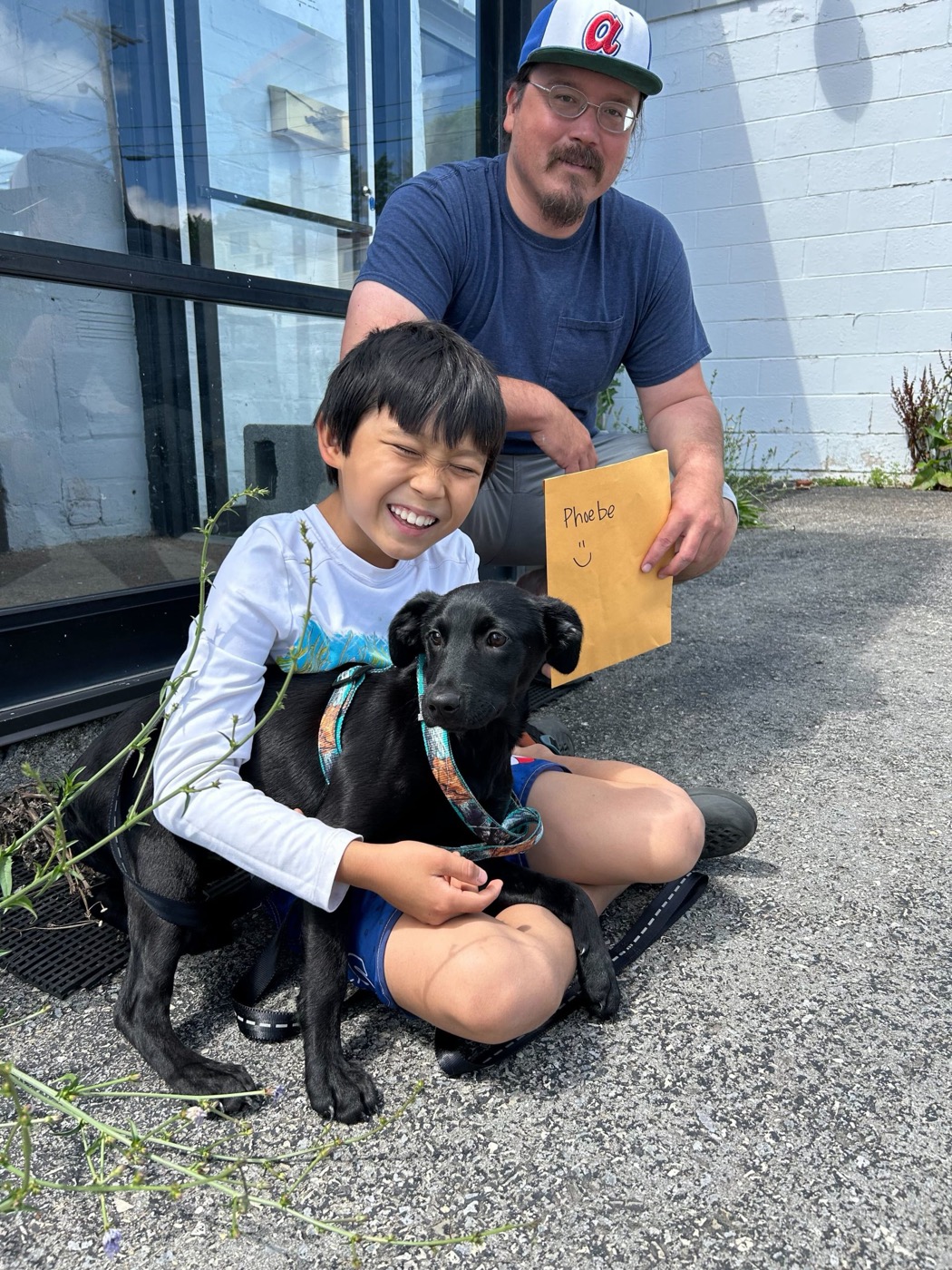 A newly adopted pet with their family